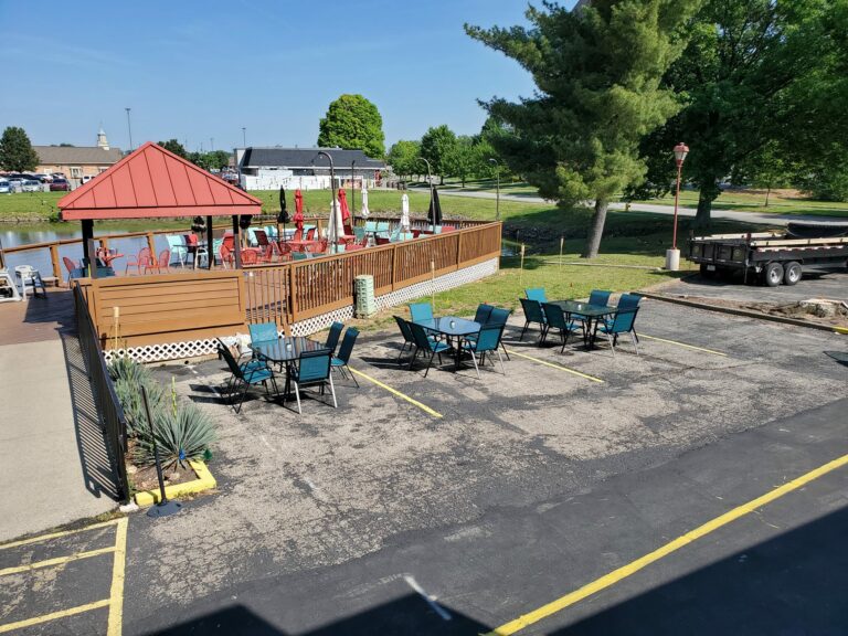 Construction vehicles parked in restaurant parking lot